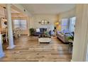 Spacious living room with hardwood floors, neutral colors, and ample natural light at 8731 Evangeline Dr, North Charleston, SC 29420