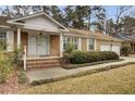 Brick house featuring a double front door and manicured shrubs at 107 Old Tavern Ln, Summerville, SC 29485