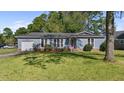 Ranch style house with a gray exterior and landscaped yard at 115 Three Wood Ln, Summerville, SC 29483