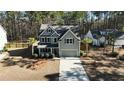 Two-story house with gray siding, driveway and landscaping, viewed from above at 123 Beam St, Huger, SC 29450