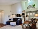 Open living room features a comfortable sectional sofa and a view of the kitchen at 1481 Center Street Ext # 1808, Mount Pleasant, SC 29464
