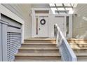Steps leading to front entrance with white door and wreath at 1723 Live Oak Park # 1723, Seabrook Island, SC 29455