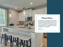 Modern kitchen with a large island and white cabinets at 2019 Quiet Ibis Rd, Hanahan, SC 29410