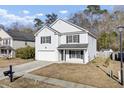 Two-story house with white siding, black shutters, and a two-car garage at 230 Eagle Ridge Rd, Summerville, SC 29485