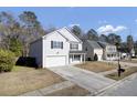 Two story house on a tree-lined street with other houses visible at 230 Eagle Ridge Rd, Summerville, SC 29485