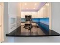 Modern kitchen with stainless steel appliances and blue backsplash at 2323 Tall Sail Dr # F, Charleston, SC 29414