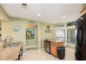 Bright kitchen with granite counters and island at 302 Summer House, Isle of Palms, SC 29451