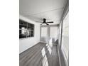 Bright sunroom featuring gray walls and wood-look floors at 348 Cleveland St, Walterboro, SC 29488