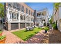 Spacious backyard with brick walkways and lush green lawn at 38 Hasell St, Charleston, SC 29401