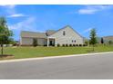 Gray house with a backyard and landscaping at 455 Switchgrass Dr, Summerville, SC 29486