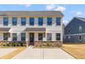Modern townhome exterior with stone and neutral siding at 5100 Park Creek Ave, North Charleston, SC 29418