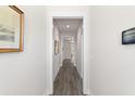 Bright hallway with hardwood floors and neutral walls at 5100 Park Creek Ave, North Charleston, SC 29418