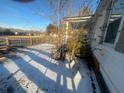 Side view of home showing wooden fence and snow-covered yard at 141 Nottingham Ln, Yemassee, SC 29945