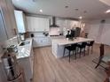 Modern kitchen with white cabinets, quartz countertops, and island at 178 Wappoo Trace Ln, Summerville, SC 29486