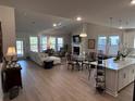 Open floorplan with kitchen, dining, and living areas at 178 Wappoo Trace Ln, Summerville, SC 29486