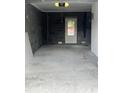 Unfinished garage with concrete floor and overhead door at 202 Cache Ct # 2, Charleston, SC 29414