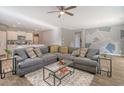 Spacious living room with gray sectional sofa and accent wall at 219 Greenwich Dr, Summerville, SC 29486
