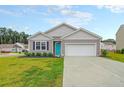 Charming house with teal front door and well-manicured lawn at 221 Rubles Ln, Moncks Corner, SC 29461
