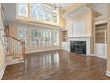 Spacious living room with hardwood floors and fireplace at 4245 Club Course Dr, North Charleston, SC 29420
