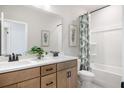 Modern bathroom with double vanity, a bathtub, and a tropical shower curtain at 472 White Magnolia St, Moncks Corner, SC 29461
