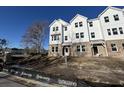 Three-story townhome with white siding and brick accents at 5134 Double Eagle, Summerville, SC 29485