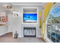 Living room fireplace with built-in shelving and a flat-screen TV above at 700 Daniel Ellis Dr # 2201, Charleston, SC 29412