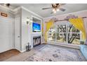 Cozy living room boasts a fireplace, large windows, and a comfortable sofa at 700 Daniel Ellis Dr # 2201, Charleston, SC 29412
