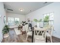 Bright dining area with hardwood floors and a view of the living room at 101 Aplomb Alley # 10, Charleston, SC 29414