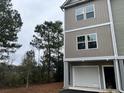 Modern two-story townhome with attached garage, offering curb appeal at 107 Aplomb Alley # 13, Charleston, SC 29414