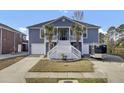 Two-story house with gray siding, white trim, and a large front porch at 1201 Roma Rd, Hanahan, SC 29410