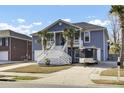 Two-story house with gray siding, white trim, and a large front porch at 1201 Roma Rd, Hanahan, SC 29410