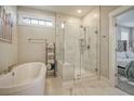 Modern bathroom with a soaking tub, glass shower, and marble tile at 128 Sandy Bend Ln, Summerville, SC 29486