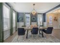 Elegant dining room with a statement light fixture and ample natural light at 128 Sandy Bend Ln, Summerville, SC 29486