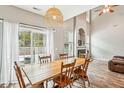 Dining room with a farmhouse table, hardwood floors, and access to the backyard at 2005 Isabela Ct, Summerville, SC 29483