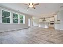 Open living space with hardwood floors and views into kitchen area at 3893 James Bay Rd, Johns Island, SC 29455