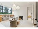Bright living room with fireplace and open floor plan at 3 Chisolm St # 106, Charleston, SC 29401