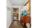 Inviting entryway with hardwood floors and antique console table at 407 Yacht Harbor Ct, Isle of Palms, SC 29451