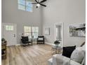 Bright living room featuring hardwood floors, high ceilings, and ample natural light at 538 Harris Hill Rd, Johns Island, SC 29455