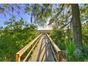 Serene boardwalk leads to tranquil waterfront views at 5440 Overland Trl, North Charleston, SC 29420