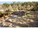 Aerial view of a single story brick home with large yard at 601 Levee Dr, Moncks Corner, SC 29461