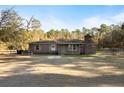 Brick ranch home with covered porch and large yard at 601 Levee Dr, Moncks Corner, SC 29461