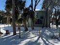 Two story home with wrap around deck, stairs and fenced yard at 613 Pompano St, Edisto Island, SC 29438