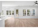 Bright and airy living room with hardwood floors and lots of natural light at 6522 Beagle Club Rd, Meggett, SC 29449
