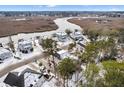 Community overview featuring waterfront homes and snowy landscape at 7003 Old Landing Dr, Hanahan, SC 29410