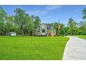 Two story home with a long driveway and a spacious lawn at 975 Mayfield St, Summerville, SC 29485