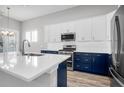 Modern kitchen with white and navy cabinets and quartz countertops at 105 Waxwing Dr, Summerville, SC 29483