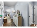 An entryway with a console table and view to the living room at 115 Holly Leaf Ln, Summerville, SC 29486