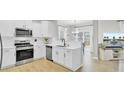 Modern white kitchen with stainless steel appliances at 155 Surfbird Rd, Summerville, SC 29486