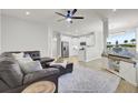 Open concept living room with kitchen view and sectional sofa at 155 Surfbird Rd, Summerville, SC 29486
