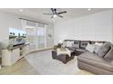 Spacious living room featuring a sectional sofa and large TV at 155 Surfbird Rd, Summerville, SC 29486